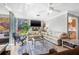 Comfortable living room with tile floors, ceiling fan, sliding doors and exterior view at 615 10Th Ne Ave # 1, St Petersburg, FL 33701
