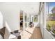 Relaxing enclosed porch with seating area, tile flooring, and sliding glass doors at 615 10Th Ne Ave # 1, St Petersburg, FL 33701