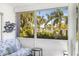 Sunroom with nice view of the outdoors, palm trees, and tropical foliage at 615 10Th Ne Ave # 1, St Petersburg, FL 33701