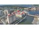 Aerial view of waterfront condos featuring boat docks, a red tiled roof, rooftop parking and views of the city at 700 S Harbour Island Blvd # 231, Tampa, FL 33602