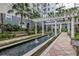 Beautiful courtyard with water feature, benches, and manicured plants at 700 S Harbour Island Blvd # 231, Tampa, FL 33602