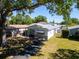 Charming home featuring a spacious, grassy backyard with mature trees and ample sunlight at 753 Almeda N St, St Petersburg, FL 33702