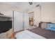 Bedroom view showcasing neutral walls, a built-in media center, and access to additional living space at 753 Almeda N St, St Petersburg, FL 33702