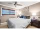 Cozy bedroom features a comfortable bed, ceiling fan, and neutral decor, creating a relaxing and inviting atmosphere at 753 Almeda N St, St Petersburg, FL 33702