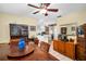 Dining area with wood furniture and a view into the open kitchen and living spaces at 753 Almeda N St, St Petersburg, FL 33702