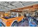 Inside the garage, a large vehicle is accompanied by plenty of storage space and items at 753 Almeda N St, St Petersburg, FL 33702