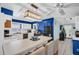 Bright kitchen with an island, stainless steel appliances, and view of the adjacent dining area at 753 Almeda N St, St Petersburg, FL 33702