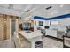 Spacious kitchen featuring a breakfast bar, stainless steel appliances, and bright blue accent wall at 753 Almeda N St, St Petersburg, FL 33702