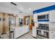 Open kitchen with an island, stainless steel appliances, and plenty of cabinet space at 753 Almeda N St, St Petersburg, FL 33702
