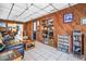 Cozy living room with wood paneled walls, tile flooring, and comfortable seating area at 753 Almeda N St, St Petersburg, FL 33702