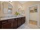 Bathroom with granite countertops, double vanity, and a walk-in closet at 8078 Pine Crest St, Seminole, FL 33777