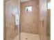 Bathroom with a walk-in shower with tile surround, and a small window at 8078 Pine Crest St, Seminole, FL 33777