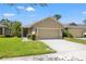 Charming single-story home featuring a two-car garage and well-maintained landscaping in a quiet neighborhood at 8078 Pine Crest St, Seminole, FL 33777