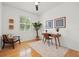 Home office showcasing hardwood floors, plantation shutters, and a modern desk at 8078 Pine Crest St, Seminole, FL 33777