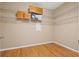 Walk-in closet with white wire shelving and hardwood floors at 8078 Pine Crest St, Seminole, FL 33777