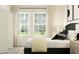 Bright bedroom featuring neutral tones, abundant natural light, and a tranquil ambiance at 8536 Bella Mar Trl, Parrish, FL 34219