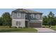 Two story home with grey siding, attached two car garage, landscaped yard and concrete driveway at 8536 Bella Mar Trl, Parrish, FL 34219
