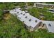 Overhead shot showcasing condo's roof with mature trees surrounding the building at 870 Virginia St # 109, Dunedin, FL 34698
