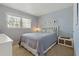 Cozy bedroom featuring a comfortable bed, side tables, and a bright window at 870 Virginia St # 109, Dunedin, FL 34698