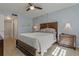 Comfortable main bedroom with a ceiling fan, bedside tables with lamps, and a cozy ambiance at 870 Virginia St # 109, Dunedin, FL 34698