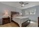 Serene main bedroom with a ceiling fan, bedside tables and lamps, creating a relaxing retreat at 870 Virginia St # 109, Dunedin, FL 34698