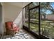 Enjoy the outdoors from this screened patio with lush greenery and comfortable seating at 870 Virginia St # 109, Dunedin, FL 34698