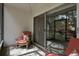 Relaxing screened patio with comfortable wicker seating and view of landscaped grounds at 870 Virginia St # 109, Dunedin, FL 34698