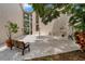 Spacious outdoor patio area with seating, perfect for relaxing and enjoying the surroundings at 870 Virginia St # 109, Dunedin, FL 34698