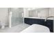 Elegant bathroom featuring a modern soaking tub, glass-enclosed shower, sleek fixtures, and double vanity at 1030 11Th S Ave, St Petersburg, FL 33705