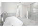 Elegant bathroom featuring a modern soaking tub, glass-enclosed shower, and sleek fixtures at 1030 11Th S Ave, St Petersburg, FL 33705