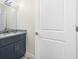 Clean bathroom with granite countertop, modern fixtures, and a white door at 1030 11Th S Ave, St Petersburg, FL 33705
