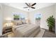 Inviting bedroom showcasing a comfortable bed, stylish decor, and abundant natural light through windows at 1030 11Th S Ave, St Petersburg, FL 33705