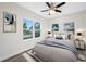 Bright bedroom featuring wood-look flooring, two large windows, and neutral decor at 1030 11Th S Ave, St Petersburg, FL 33705