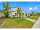 Modern two-story home with a bright white exterior, manicured lawn, and a welcoming front porch at 1030 11Th S Ave, St Petersburg, FL 33705