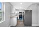 Modern kitchen features white cabinets, stainless steel appliances, and granite countertops at 1030 11Th S Ave, St Petersburg, FL 33705