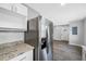 The kitchen offers granite counters and modern stainless steel appliances at 1030 11Th S Ave, St Petersburg, FL 33705