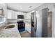 Well-equipped kitchen with stainless steel fridge, microwave, and stove at 1030 11Th S Ave, St Petersburg, FL 33705