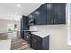 Modern kitchen featuring gray cabinets, stainless steel appliances, and quartz countertops, and a decorative backsplash at 1030 11Th S Ave, St Petersburg, FL 33705