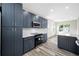 Contemporary kitchen with dark cabinets, stainless appliances, white backsplash and stone countertops at 1030 11Th S Ave, St Petersburg, FL 33705