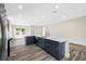 Spacious open-concept kitchen boasts a large island, gray cabinetry, stainless steel appliances, and ample natural light at 1030 11Th S Ave, St Petersburg, FL 33705