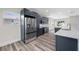 Stylish kitchen with gray cabinetry, stainless steel appliances, quartz countertops, and a bright, open layout at 1030 11Th S Ave, St Petersburg, FL 33705