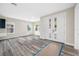 Bright living room with modern wood flooring, plenty of natural light, and a view of the entryway at 1030 11Th S Ave, St Petersburg, FL 33705