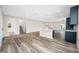 Open-concept living area with wood-look flooring and natural light at 1030 11Th S Ave, St Petersburg, FL 33705