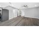 Open-concept living room with gray walls and modern ceiling fan for a bright and airy atmosphere at 1030 11Th S Ave, St Petersburg, FL 33705