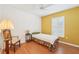 Cozy bedroom featuring a ceiling fan and a bright accent wall with a window at 10530 Maronda Dr, Riverview, FL 33569