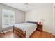 Bedroom with natural light, ceiling fan, hardwood flooring, and a view of the outside at 10530 Maronda Dr, Riverview, FL 33569