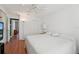Spacious bedroom with white walls, ceiling fan, access to another room, and closet at 10530 Maronda Dr, Riverview, FL 33569