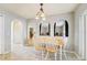 Bright breakfast nook featuring a table and chairs, decorative lighting, and access to adjacent rooms at 10530 Maronda Dr, Riverview, FL 33569