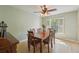 Inviting dining room with a wooden table, six chairs, and a window with shutters at 10530 Maronda Dr, Riverview, FL 33569