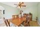 Charming dining room featuring wood table, chairs, and a decorative ceiling fan with lighting at 10530 Maronda Dr, Riverview, FL 33569